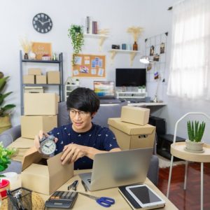 start-up-small-business-asian-man-young-entrepreneur-preparing-parcels-packing-cardboard-box_357951-157
